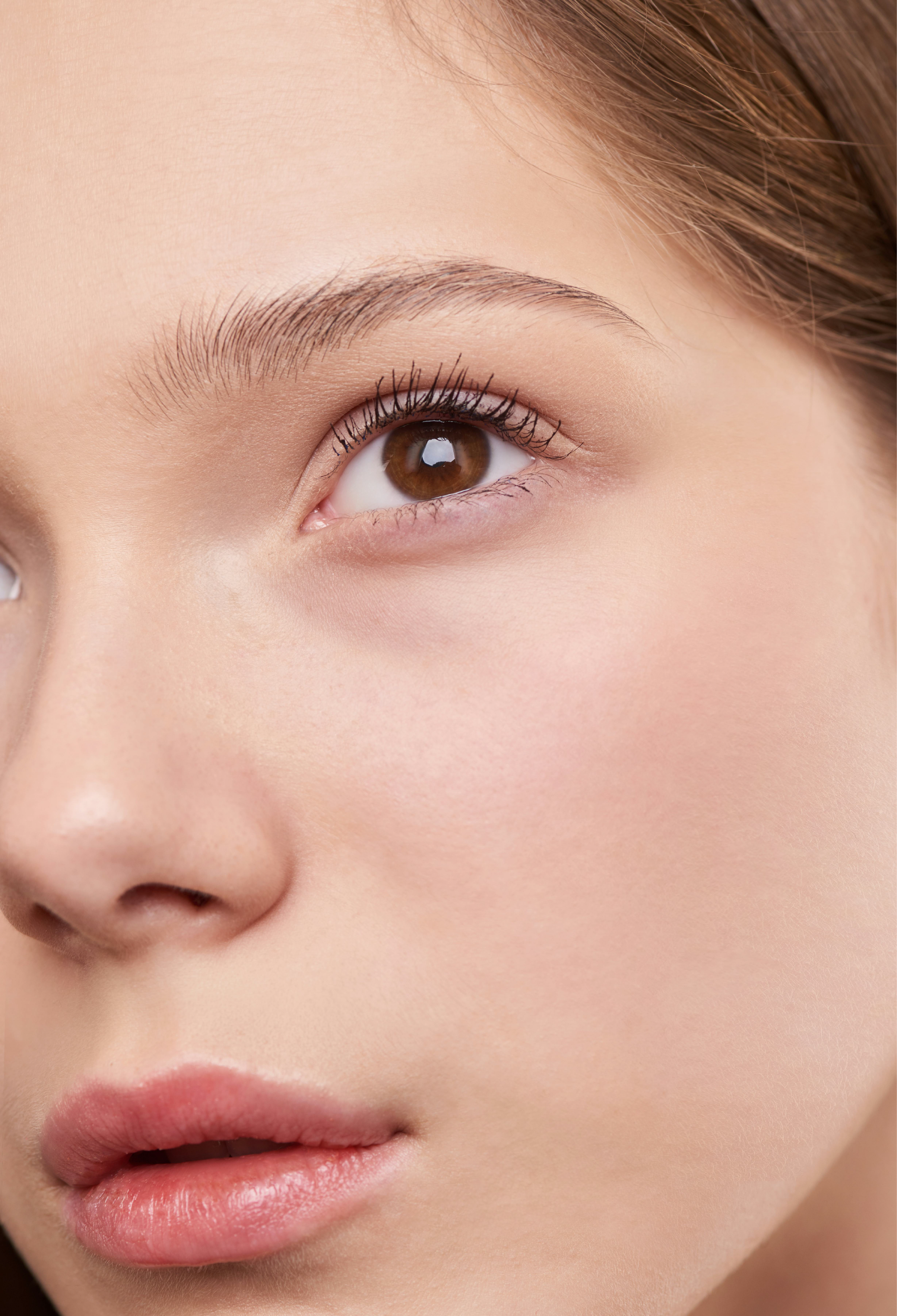 Woman's face close-up with skin analysis